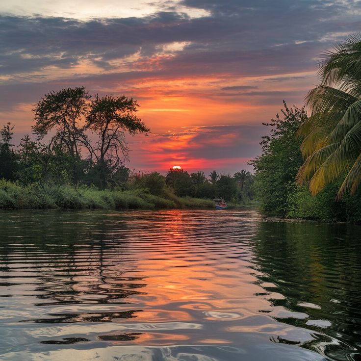 Sunset over the Nile River with glowing skies and tranquil water reflections